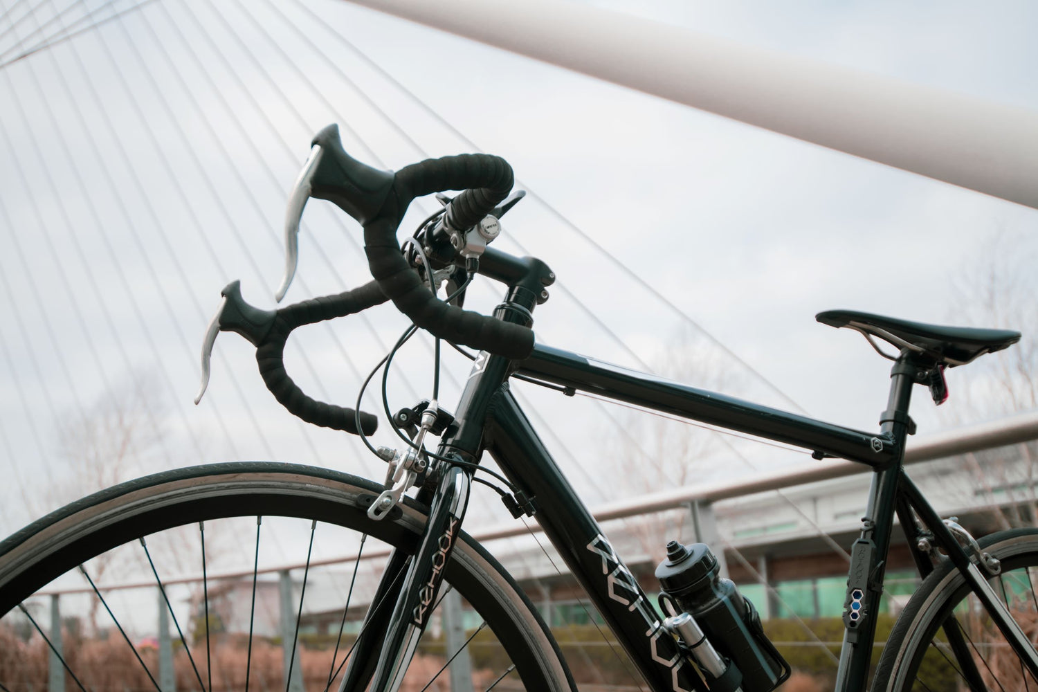 rehook bike with recycled leak free water bottle attached to bike frame