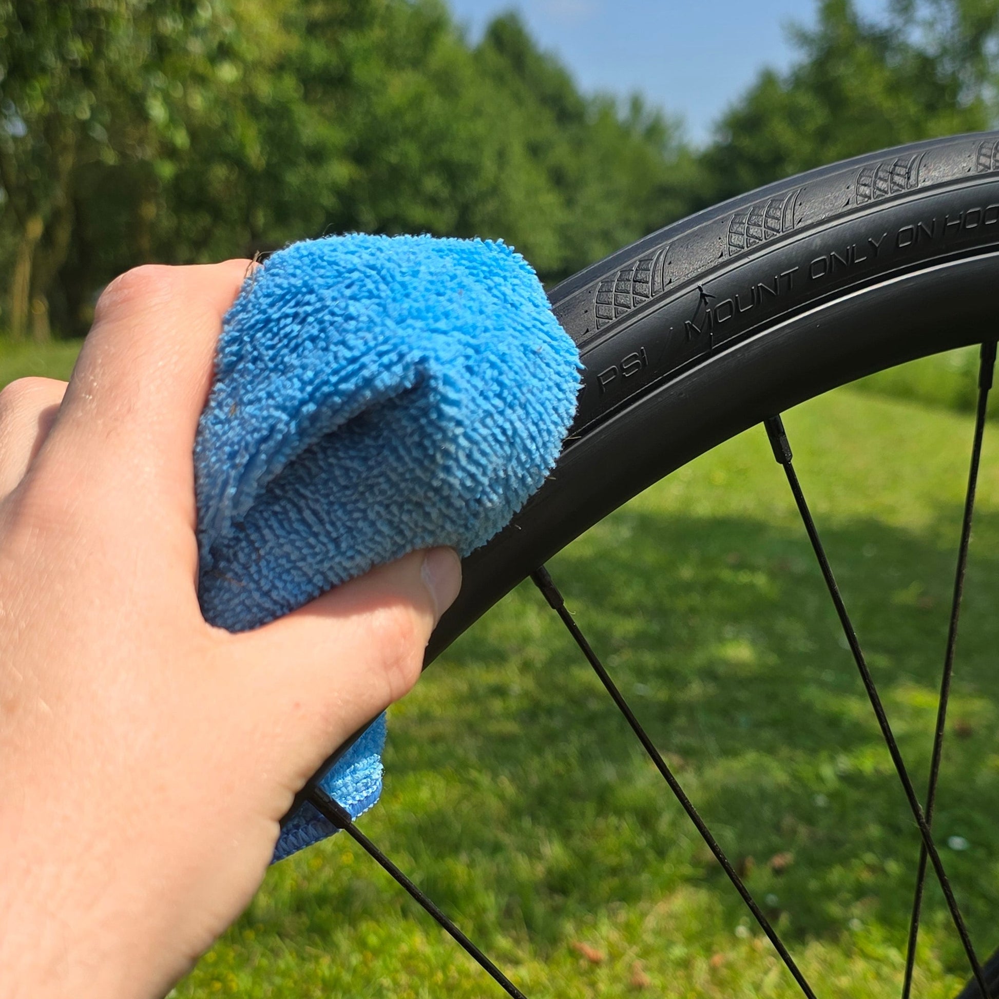 bike tyre conditioner applied to bicycle tyre